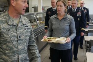 The Woman in Line Everyone Dismissed Until the Entire Base Stood…
